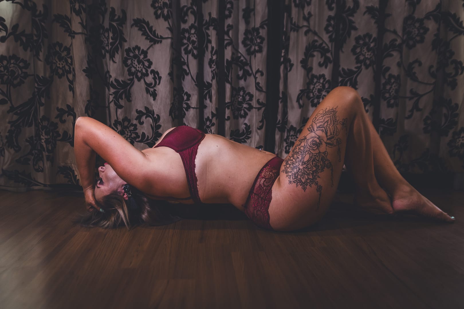 Lady In Red Lingerie Posed On Floor